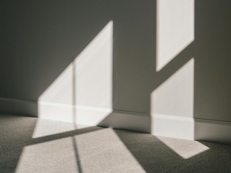 A calm and spacious room for yoga practice with soft light.